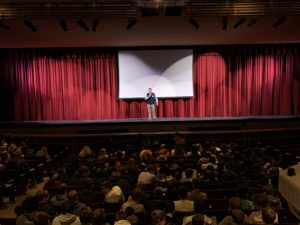 Scott Givens speaks to students Fremont High School Auditorium